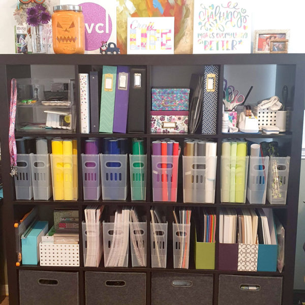 this is a bookcase filled with craft items for a backdrop of my live streaming videos